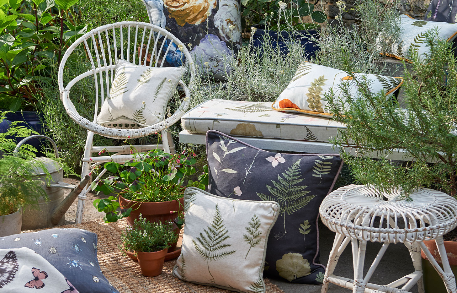 multiple cushions in garden setting made from botanica fabrics